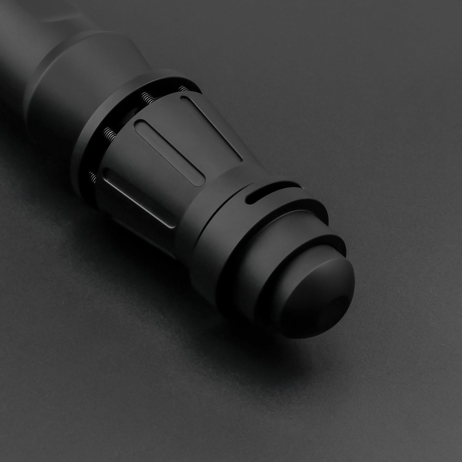 Partial view of dark rey saber hilt