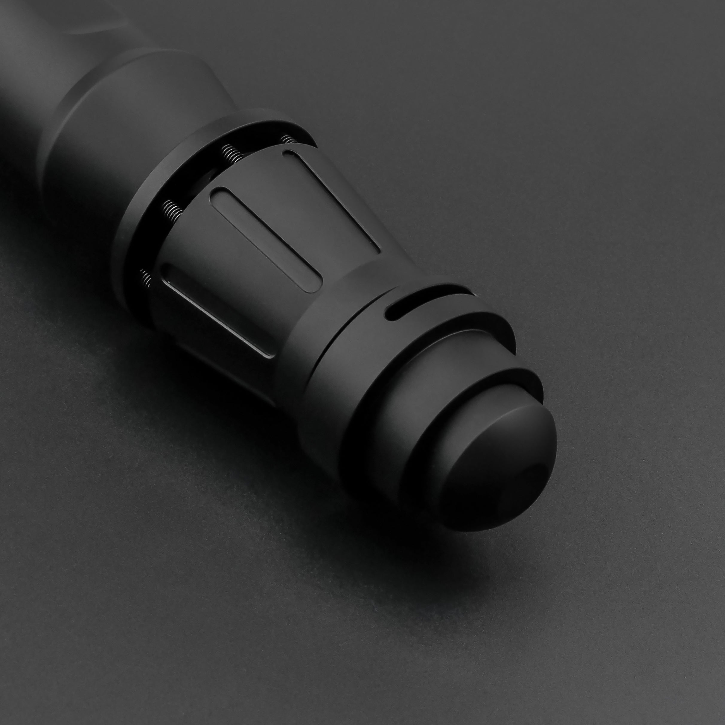 Partial view of dark rey saber hilt